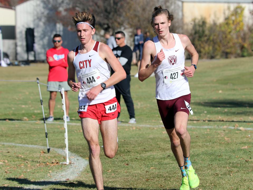 Dowling Catholic's Jackson Heidesch (427) set a new state meet record with a 5K time of 14:56.66 to repeat as 4A individual champion and help the Maroons win another team championship Saturday in Fort Dodge.