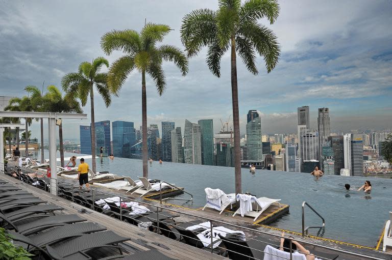 A file photo shows a view of the Singapore skyline, May 2014. A dementia-stricken widow has launched legal action to reclaim her fortune from a Chinese tour guide