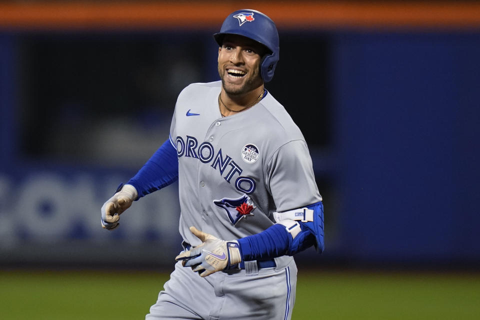 Toronto Blue Jays' George Springer smiles as he runs the bases after hitting a home run against the New York Mets during the first inning of a baseball game Friday, June 2, 2023, in New York. (AP Photo/Frank Franklin II)