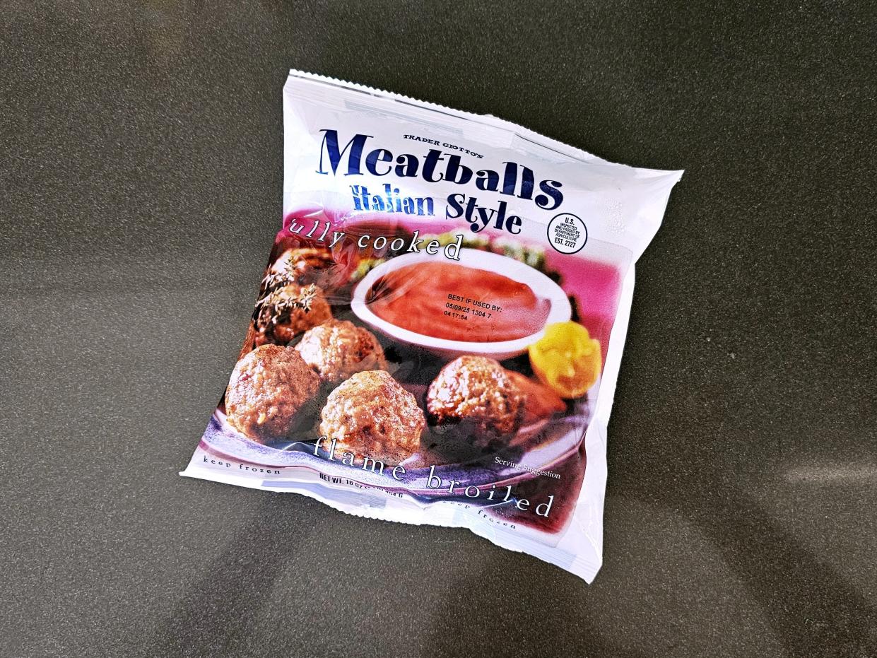 A bag of Trader Joe's Italian-style meatballs against a black background.