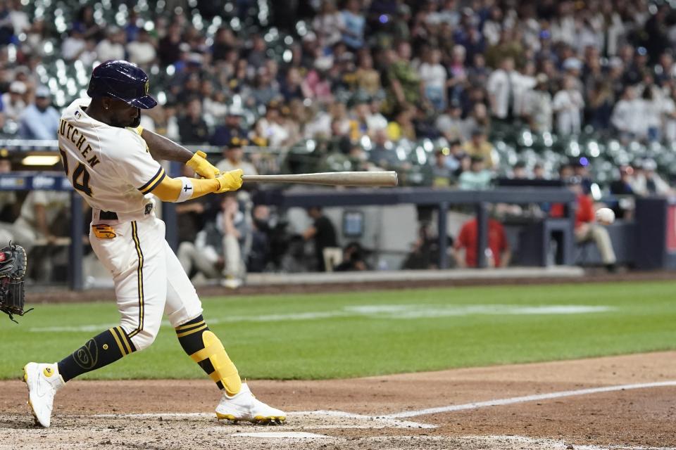 Milwaukee Brewers' Andrew McCutchen hits a walk-off RBI single during the ninth inning of a baseball game against the San Diego Padres Thursday, June 2, 2022, in Milwaukee. The Brewers won 5-4. (AP Photo/Morry Gash)