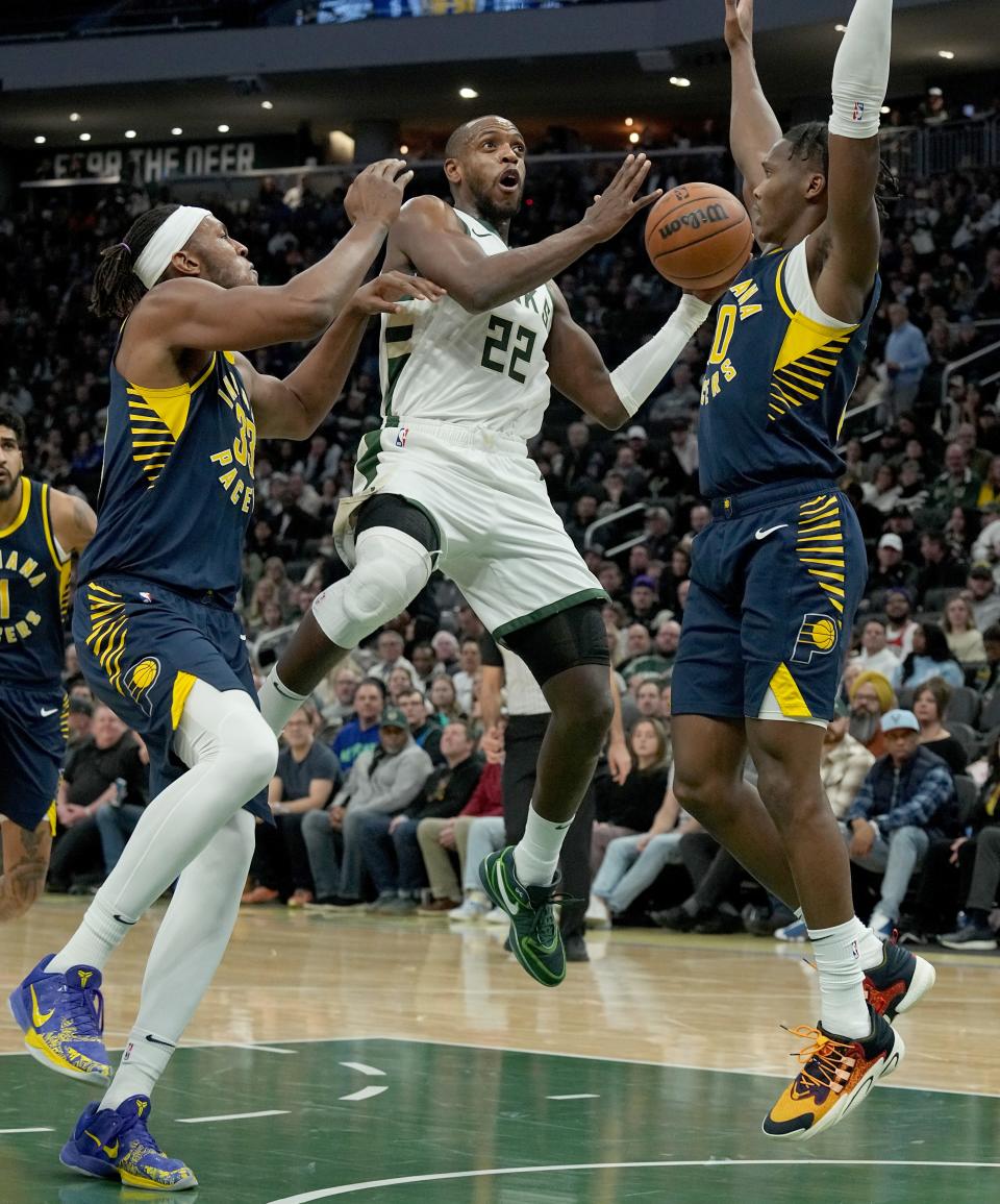 Bucks forward Khris Middleton is fouled by Indiana Pacers guard Bennedict Mathurin during their game Dec. 13.