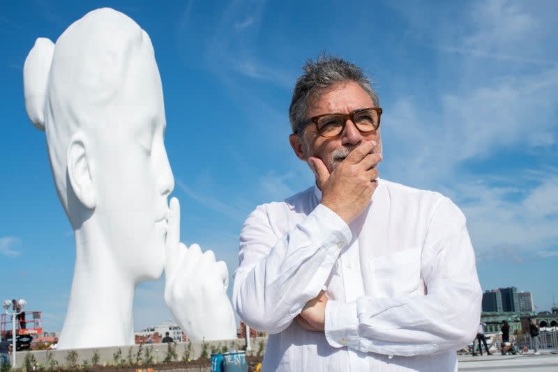 Artist Jaume Plensa poses for a photo near his statue "Water's Soul" in Jersey City