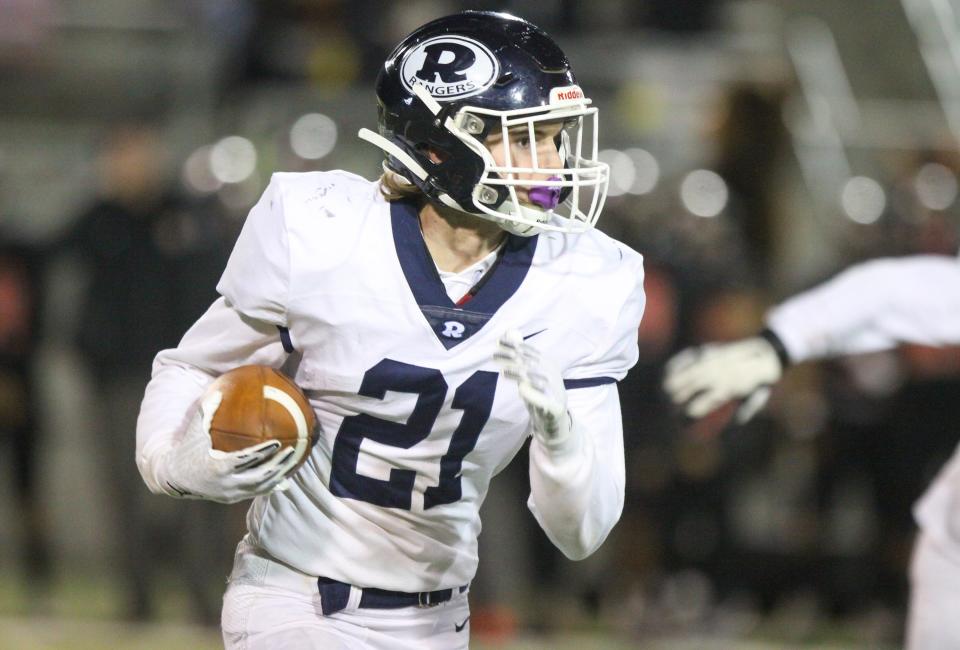 RedwoodÕs Alex Perch carries the ball on a sweep in a Central Section Division I high school first-round football playoff game on Friday, November 4, 2022.