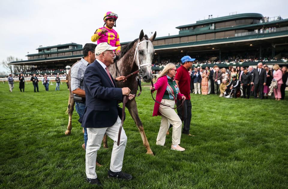 Jockey Luis Saez aboard Tapit Trice is led through the Winner's Circle after winning the $1 million 2023 Toyota Blue Grass Stakes Saturday at Keeneland. April 8, 2023