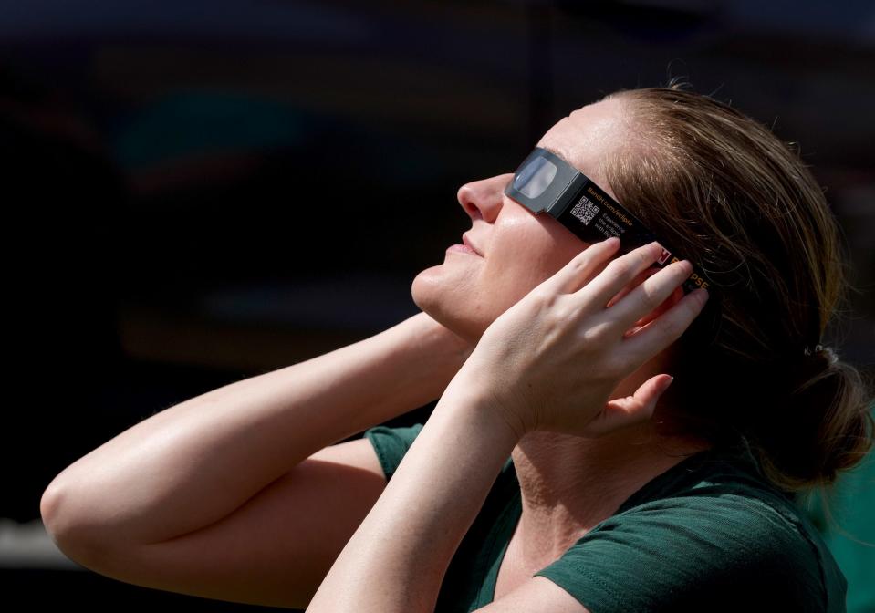 Bethany Rushing of Providence joined many others at the Museum of Natural History and Planetarium in Roger Williams Park to view the eclipse.