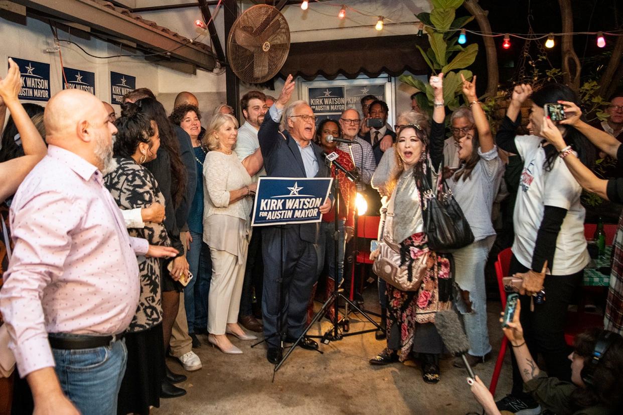 Kirk Watson speaks with supporters  at Santa Rita Tex Mex Cantina on Dec. 13 after the votes that had been counted indicated he would be the winner of the mayoral runoff election.