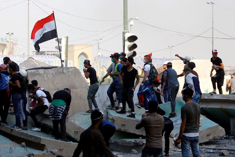 Demonstrators take part on the ongoing anti-government protests in Baghdad