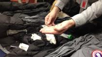 Duck feathers found inside counterfeit Canada Goose jackets are shown at a RCMP press conference on Thursday. The RCMP say that these coats could be dangerous as they won't properly insulate your body.