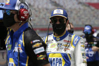 Driver Chase Elliott walks along pit road during qualifying prior to a NASCAR Cup Series auto race at Charlotte Motor Speedway Sunday, May 24, 2020, in Concord, N.C. (AP Photo/Gerry Broome)