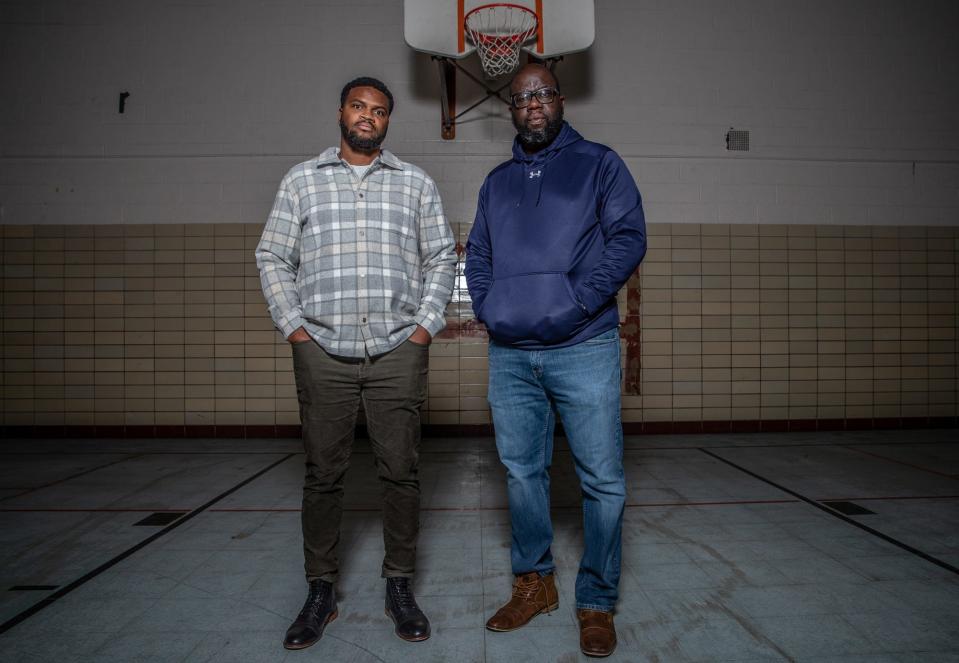 Hovey Street Church Pastor Denell Howard (right) and consulting partner Drake Crossley stand on the gym floor inside former IPS School 11 off 42nd Street on the city's east side. "As you see it's in the dark currently," Crossley said. "What you're looking at will be the Evolve Education Center." 