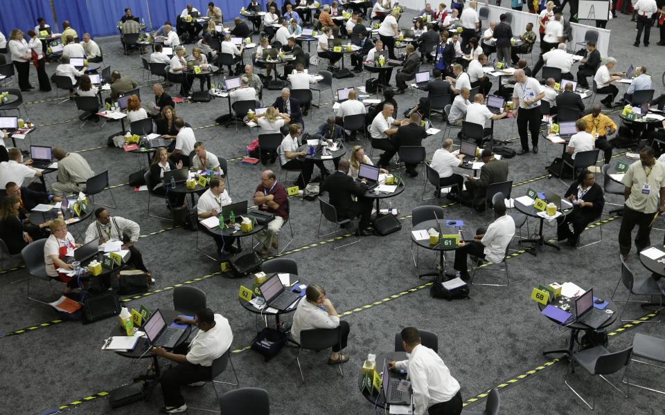 Military veterans receive resume career counseling in Detroit, Tuesday, June 26, 2012. The number of people seeking U.S. unemployment benefits fell last week, but the level of applications remains too high to signal a pickup in hiring. (AP Photo/Paul Sancya)