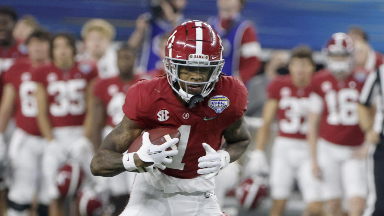 Alabama wide receiver Jameson Williams (1) makes a catch during the Cotton Bowl NCAA College Football Playoff semifinal game, Friday, Dec. 31, 2021, in Arlington, Texas. (AP Photo/Michael Ainsworth)