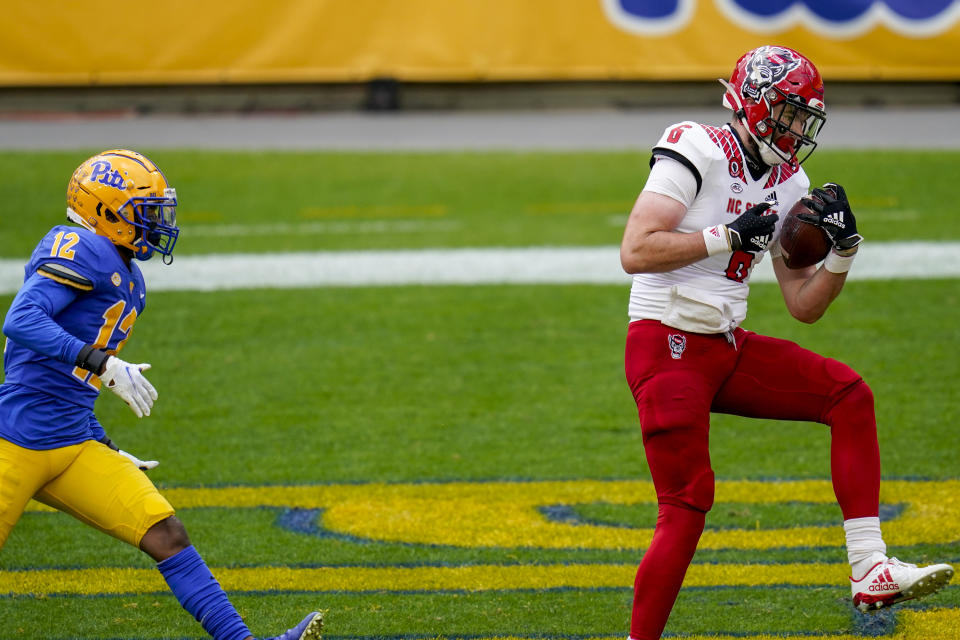 North Carolina State tight end Cary Angeline (6) makes a catch for a touchdown past North Carolina State cornerback Devan Boykin (12) in the first half of an NCAA college football game, Saturday, Oct. 3, 2020, in Pittsburgh. (AP Photo/Keith Srakocic)