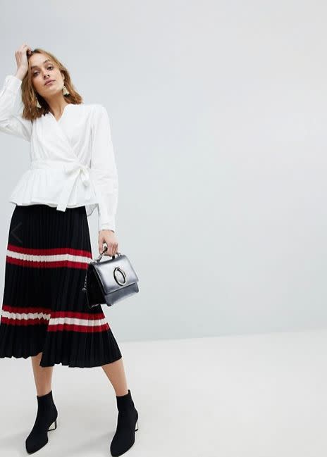 Get it <a href="http://us.asos.com/vero-moda/vero-moda-wrap-shirt-with-bubble-shoulder/prd/9126782?clr=white&amp;SearchQuery=wrap%20shirt&amp;gridcolumn=1&amp;gridrow=1&amp;gridsize=4&amp;pge=1&amp;pgesize=72&amp;totalstyles=20" target="_blank">here</a>.&nbsp;