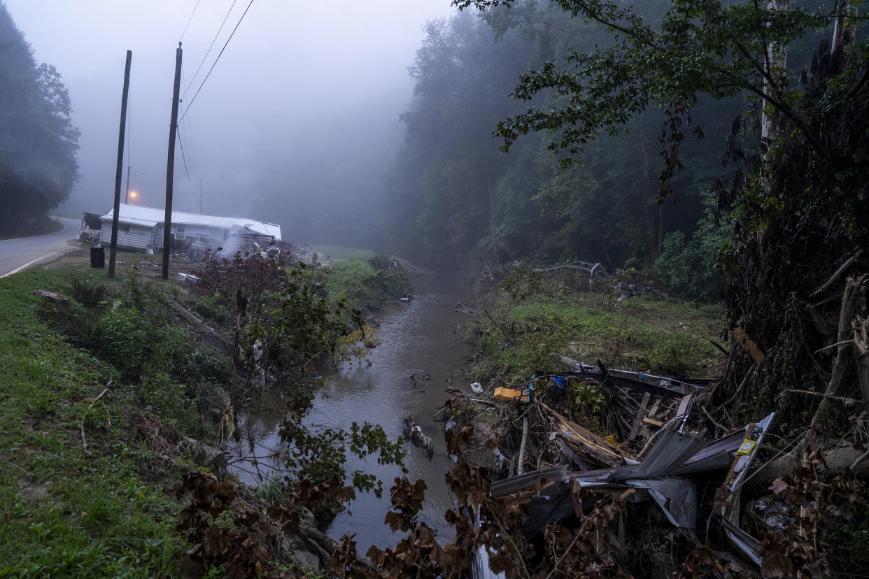 Image: A house sits on the edge of the road after it was swept from its foundation in Lost Creek, Ky., on Aug. 18, 2022. (Michael Swensen for NBC News)