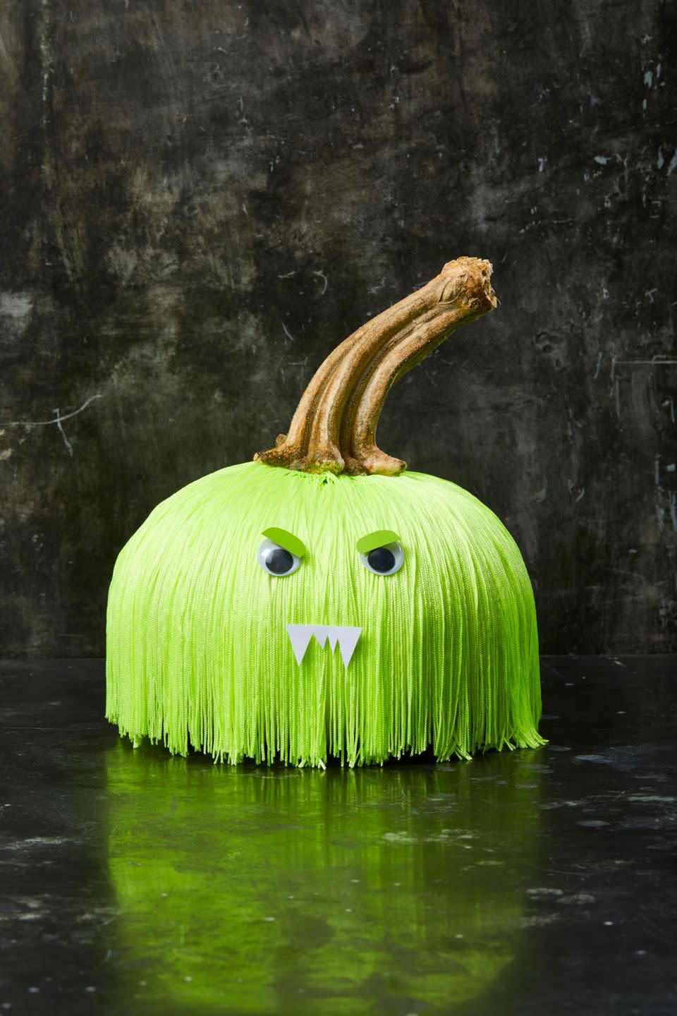 <p>This little monster is even easier to create than he looks. Just wrap and glue fringe around the stem of a pumpkin, adding 2-3 layers until it looks nice and full. Using hot glue, attach googly eyes onto the fringe and add personality with cut paper eye lids and teeth.</p><p><a class="link " href="https://www.amazon.com/Mangocore-Polyester-Trimming-Accessories-Fluorescent/dp/B076CFB7X8/?tag=syn-yahoo-20&ascsubtag=%5Bartid%7C10055.g.1714%5Bsrc%7Cyahoo-us" rel="nofollow noopener" target="_blank" data-ylk="slk:SHOP FRINGE;elm:context_link;itc:0;sec:content-canvas">SHOP FRINGE </a></p>