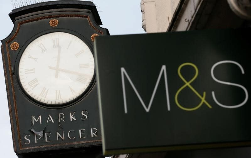 Marks & Spencer signs are seen outside outside a store in London January 8, 2014. REUTERS/Stefan Wermuth/File Photo