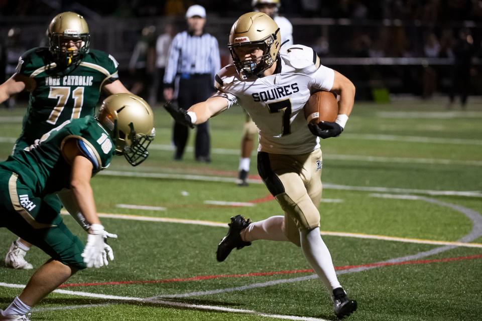 Delone Catholic's Gage Zimmerman gets around the edge on the left side to score a touchdown in overtime against York Catholic during a YAIAA Division III football game at York Catholic Stadium on Friday, September 30, 2022.