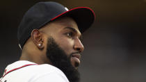 Atlanta Braves Marcell Ozuna watches play from the dugout in the fourth inning of a baseball game against the Houston Astros Saturday, Aug. 20, 2022, in Atlanta. (AP Photo/Hakim Wright Sr.)