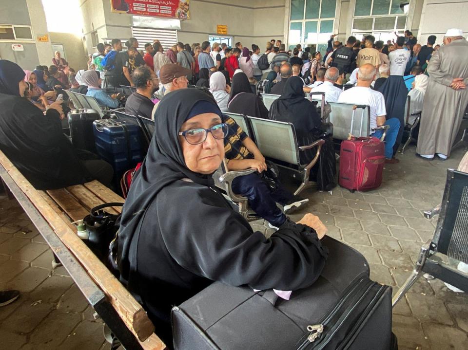 Palestinians with dual citizenship wait at the Rafah border crossing (Reuters)