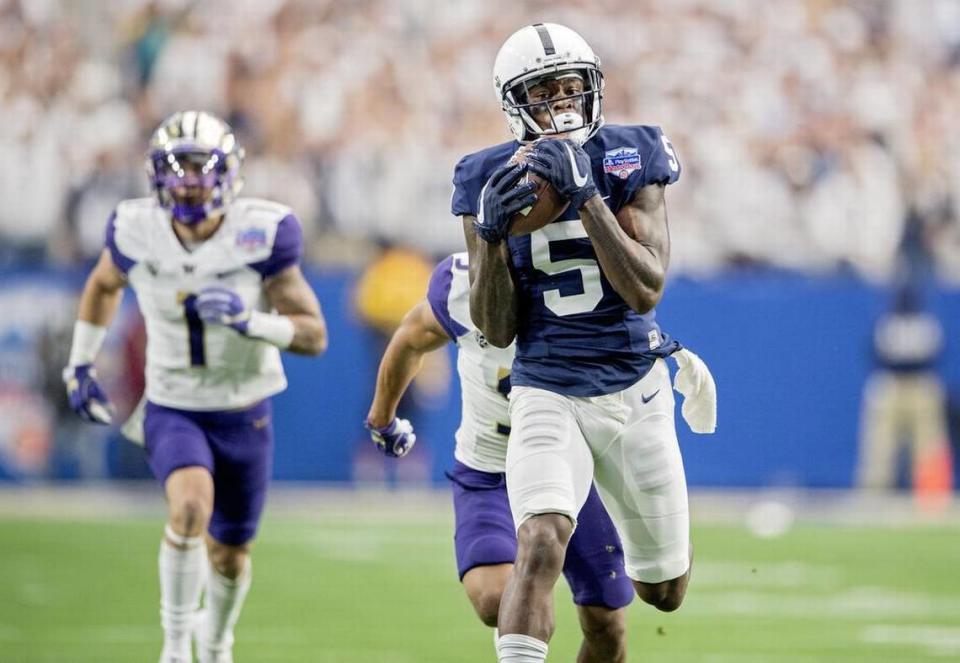 Penn State wide receiver DaeSean Hamilton makes a catch and runs it in for a touchdown ahead of Washington defenders during the 2017 Fiesta Bowl on Saturday, December 30, 2017 at University of Phoenix Stadium.