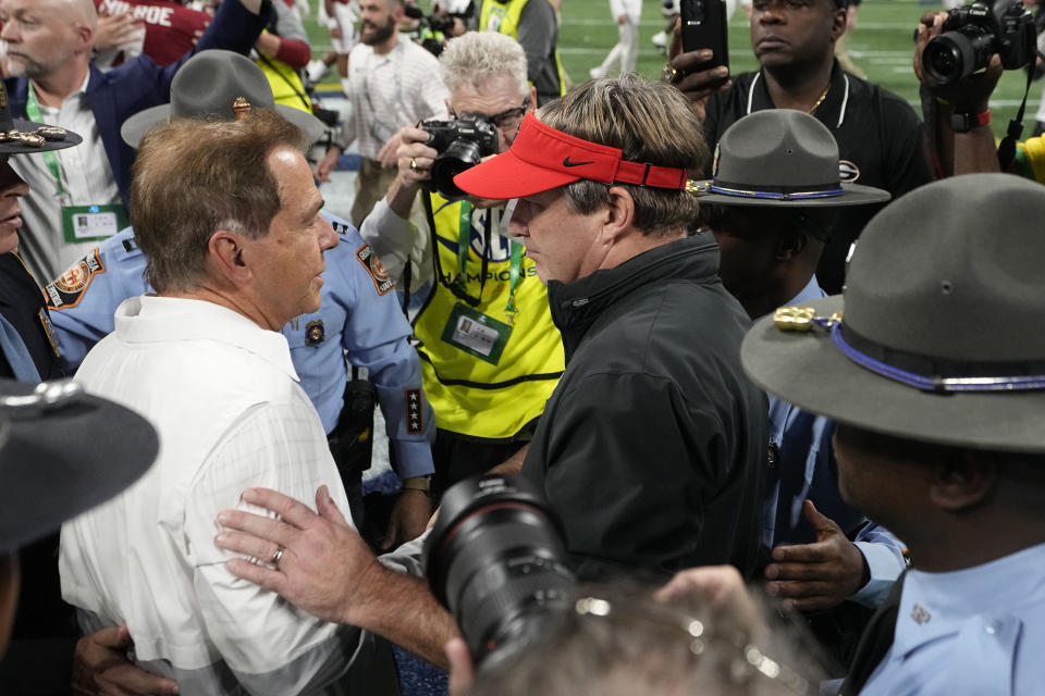 Georgia head coach Kirby Smart, and Alabama head coach Nick Saban meet after the Southeastern Conference championship NCAA college football game in Atlanta, Saturday, Dec. 2, 2023. (AP Photo/John Bazemore)