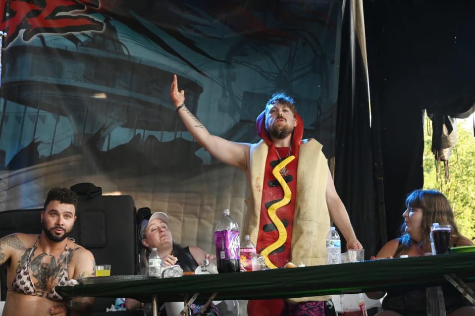 <div class="inline-image__caption"><p>A participant in the hot dog-eating competition at the 2022 Gathering of the Juggalos in Thornville, Ohio. </p></div> <div class="inline-image__credit">Nate "Igor" Smith</div>