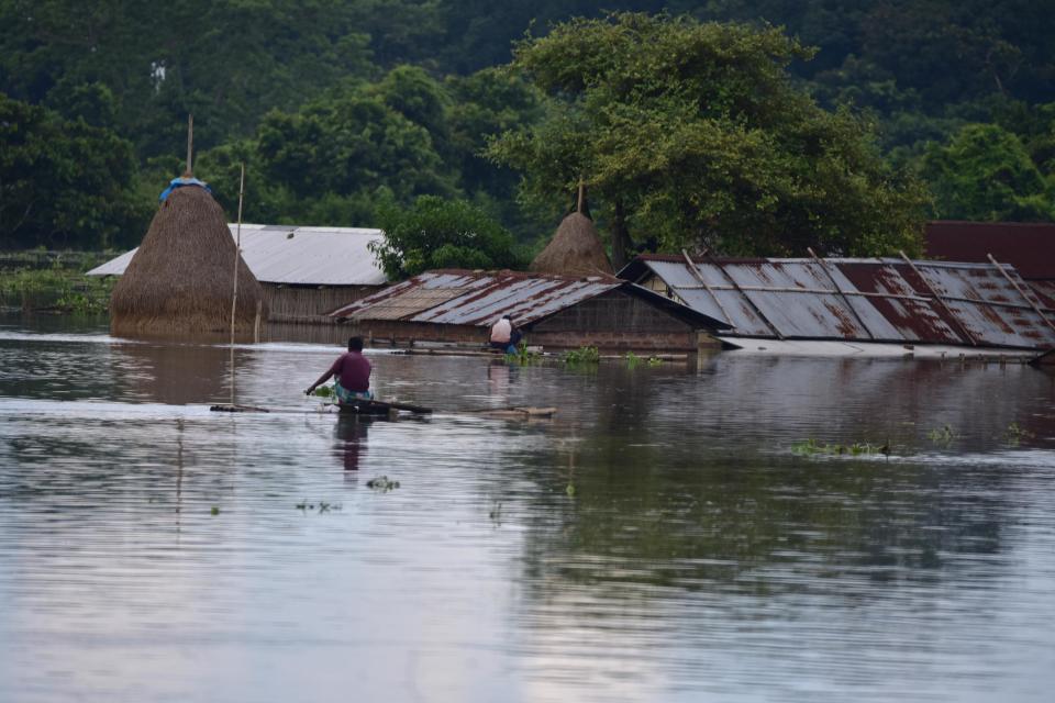 A partially submerged house at flood affected at Baghmari village near Kaziranga in Nagaon District of Assam. (Photo credit should read Anuwar Ali Hazarika/Barcroft Media via Getty Images)
