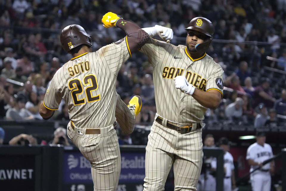 San Diego Padres' Xander Bogaerts celebrates with Juan Soto (22) after hitting a two run home run against the Arizona Diamondbacks in the third inning during a baseball game, Thursday, April 20, 2023, in Phoenix. (AP Photo/Rick Scuteri)