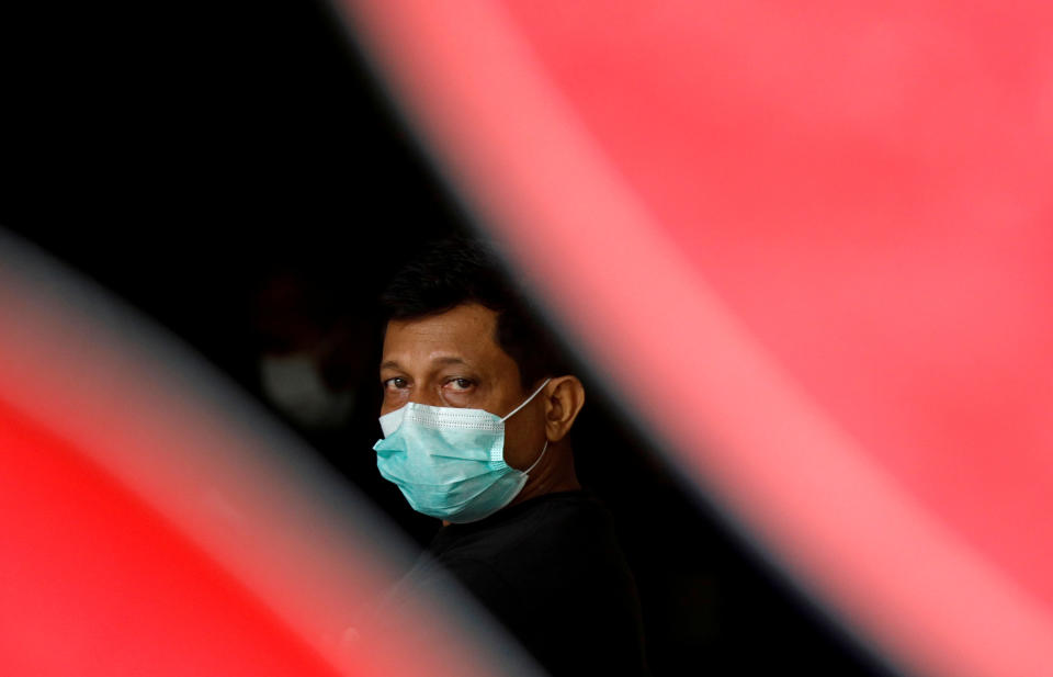 A migrant worker at a dormitory, amid the COVID-19 outbreak, here on 27 April, 2020. (PHOTO: Reuters)