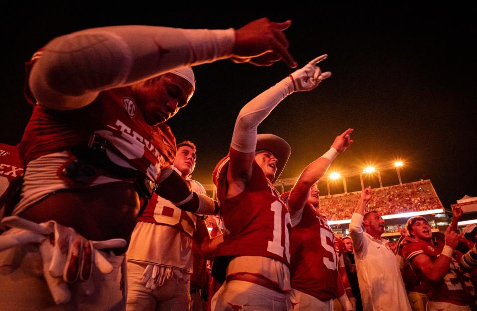 Texas players put their "horns up" after their win against the UTSA Roadrunners at Darrell K RoyalÐTexas Memorial Stadium, Saturday, Sept. 14, 2024.