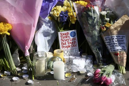 Floral tributes are laid in Parliament Square following the attack in Westminster earlier in the week, in central London, Britain March 26, 2017. REUTERS/Neil Hall