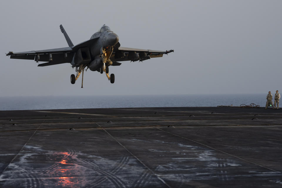 A fighter jet lands on the USS Dwight D. Eisenhower in the Red Sea on Tuesday, June 11, 2024. The USS Dwight D. Eisenhower may be one of the oldest aircraft carriers in the U.S. Navy, but it's still fighting — despite repeated false claims by Yemen's Houthi rebels. (AP Photo/Bernat Armangue)