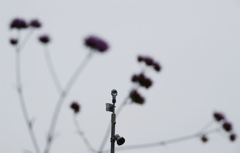 FILE PHOTO: A surveillance camera is seen in the Kings Cross area in London