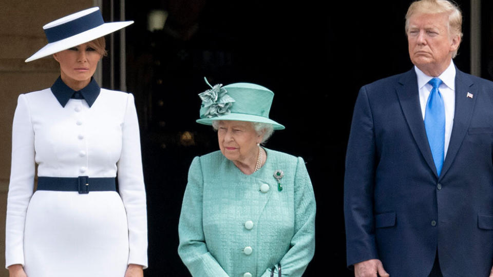 Melania Trump, the Queen and Donald Trump stand on the steps outside Buckingham Palace