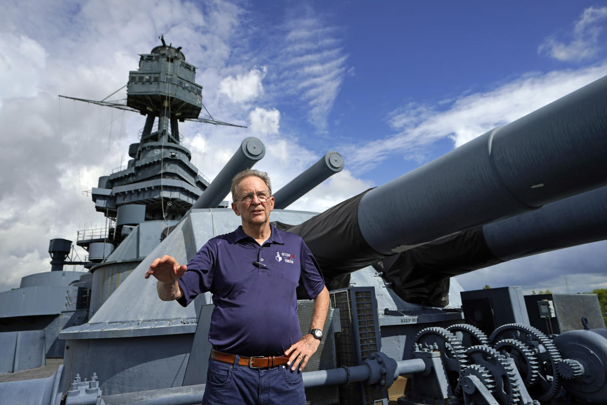 Tony Gregory, president and CEO of the Battleship Texas Foundation, stands on the deck as he talks about the upcoming move and repairs Tuesday, Aug. 30, 2022, in La Porte, Texas. The USS Texas, which was commissioned in 1914 and served in both World War I and World War II, is scheduled to be towed down the Houston Ship Channel Wednesday to a dry dock in Galveston where it will undergo an extensive $35 million repair. (AP Photo/David J. Phillip)