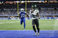 New York Jets' Elijah Moore (8) makes a touchdown reception against Indianapolis Colts' Xavier Rhodes (27) during the first half of an NFL football game, Thursday, Nov. 4, 2021, in Indianapolis. (AP Photo/AJ Mast)