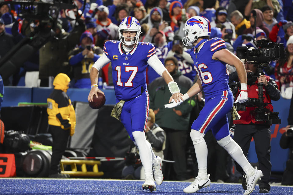 Buffalo Bills quarterback Josh Allen, left, celebrates after his touchdown with Dalton Kincaid during the second half of an NFL football game against the Denver Broncos, Monday, Nov. 13, 2023, in Orchard Park, N.Y. (AP Photo/Jeffrey T. Barnes)