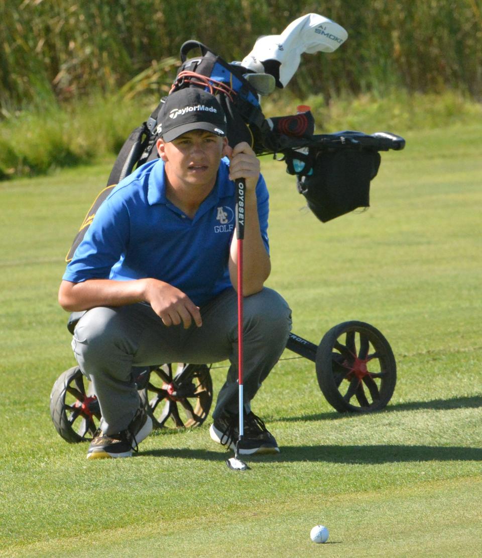 Aberdeen Central's Jackson Ravellette looks over his putt on No. 2 Red during the Watertown Boys Golf Invitational on Tuesday, Sept. 24, 2024, at Cattail Crossing Golf Course.