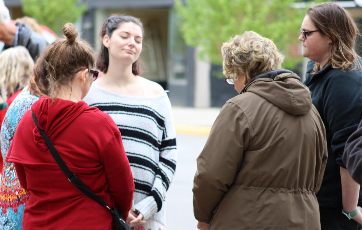 A group of women gathers to pray together during the National Day of Prayer observance on Thursday, May 5, 2022, outside the county courthouse in Marion, Ohio. Local pastors led the event and offered prayers for the community and the nation.