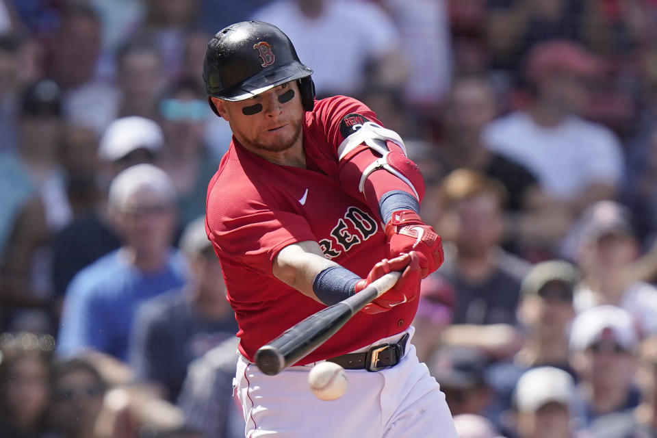Boston Red Sox's Christian Vazquez hits a double allowing J.D. Martinez to score in the fifth inning of a baseball game against the Milwaukee Brewers, Sunday, July 31, 2022, in Boston. (AP Photo/Steven Senne)