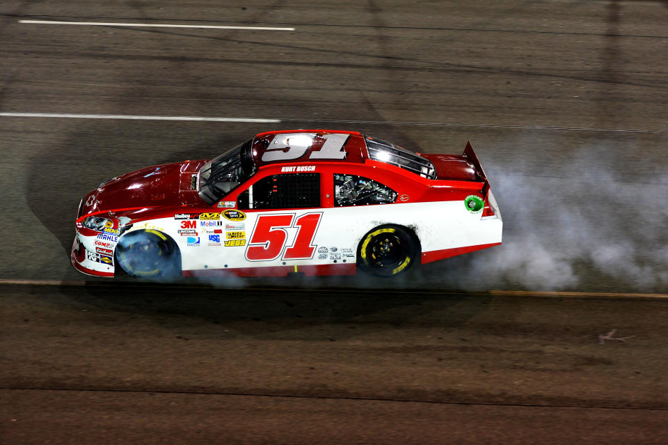 RICHMOND, VA - APRIL 28: Kurt Busch, driver of the #51 Phoenix Construction Services Chevrolet, spins out after an incident in the NASCAR Sprint Cup Series Capital City 400 at Richmond International Raceway on April 28, 2012 in Richmond, Virginia. (Photo by Drew Hallowell/Getty Images)