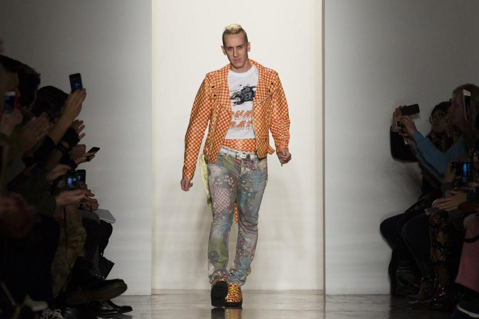 Designer Jeremy Scott greets the audience after his Fall 2013 collection at New York Fashion Week  (AP)