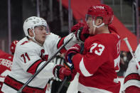 Carolina Hurricanes right wing Jesper Fast (71) and Detroit Red Wings left wing Adam Erne (73) battle in the second period of an NHL hockey game Thursday, Jan. 14, 2021, in Detroit. (AP Photo/Paul Sancya)