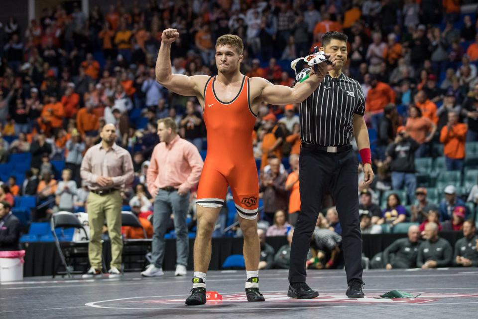 Oklahoma State wrestler Travis Wittlake, right, will be returning to his home state when the Cowboys visit Oregon State on Sunday.
