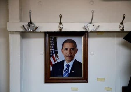 A portrait of U.S. President Barack Obama is seen in the barber shop on board the USS Harry S. Truman aircraft carrier in the eastern Mediterranean Sea, June 14, 2016. REUTERS/Baz Ratner