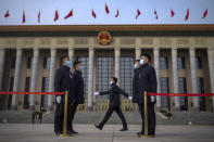 Soldiers dressed as ushers stand guard outside the Great Hall of the People ahead a preparatory session of the National People's Congress (NPC) in Beijing, Monday, March 4, 2024. (AP Photo/Andy Wong)