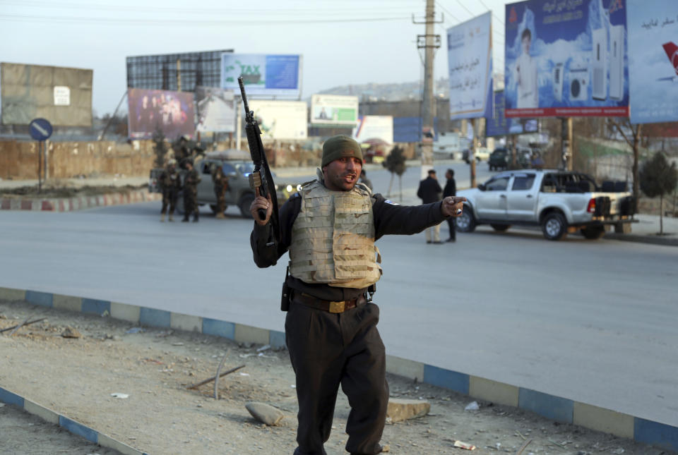 Afghan security forces arrive at the site of an explosion and attack by gunmen, in Kabul, Afghanistan, Monday, Dec. 24, 2018. (AP Photo/Rahmat Gul)