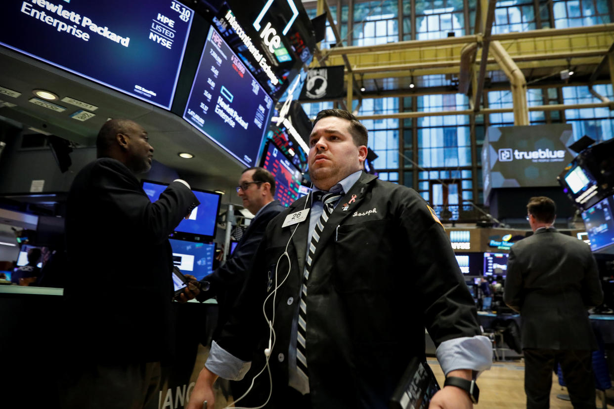 Traders work on the floor of the New York Stock Exchange (NYSE) in New York, U.S., October 24, 2018. REUTERS/Brendan McDermid